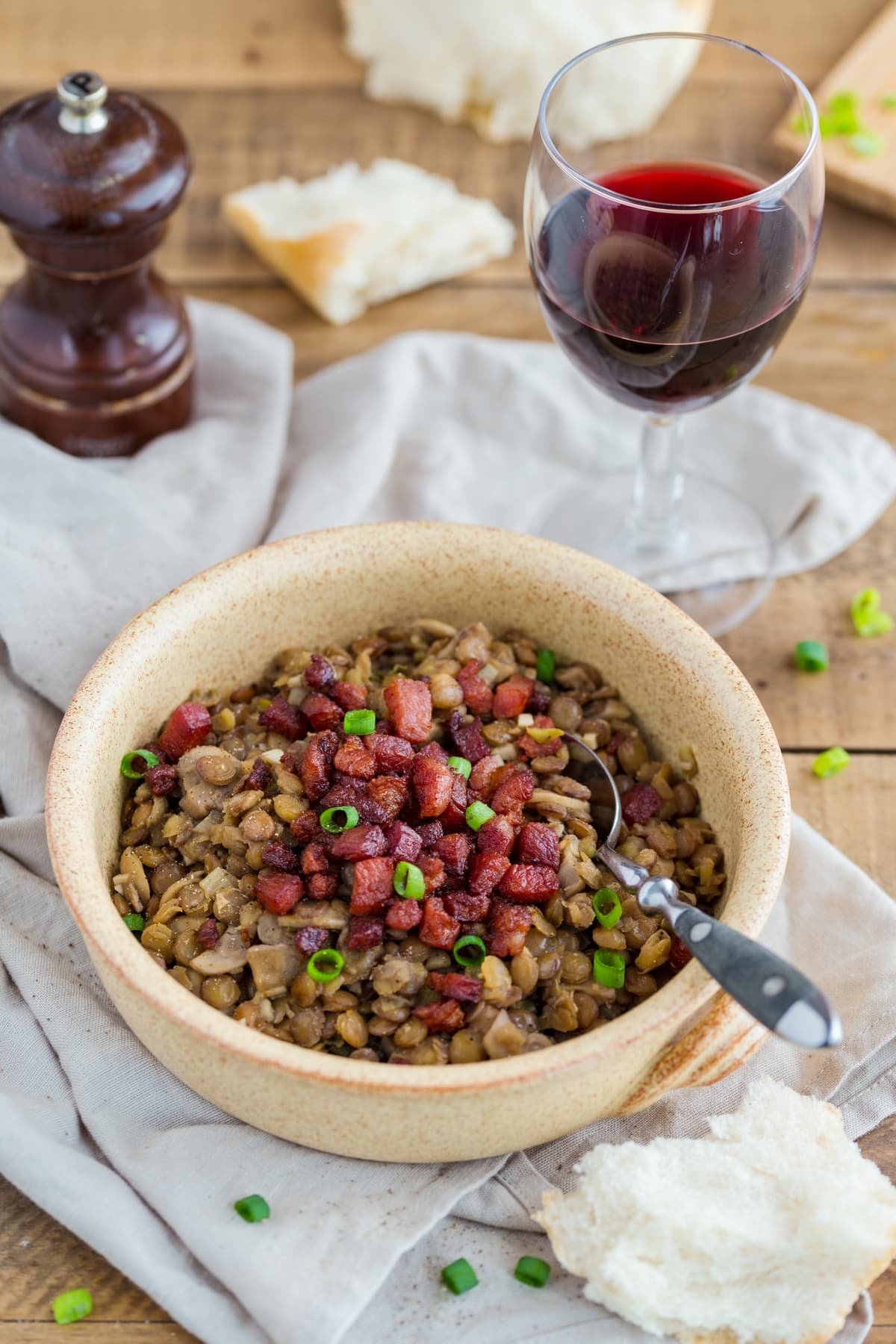 Lentil stew with crispy bacon and mushrooms.