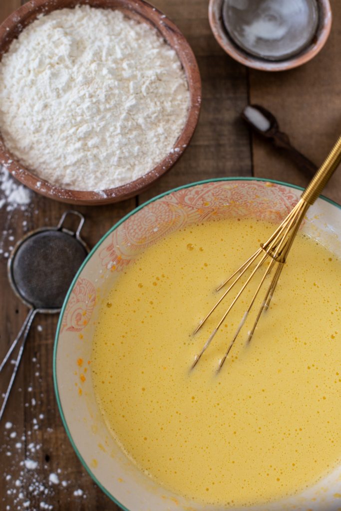 Before adding the flour to the batter.