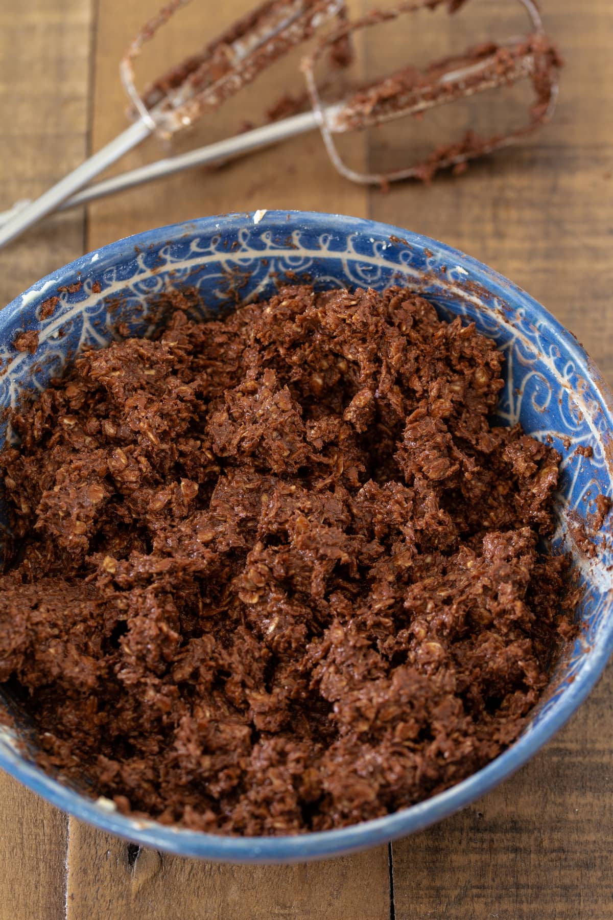 The ota balls dough in a blue bowl.