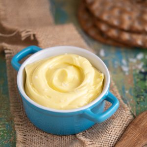 Spreadable butter in a ceramic pot.