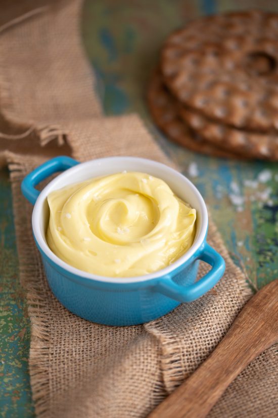 Spreadable butter in a ceramic pot.