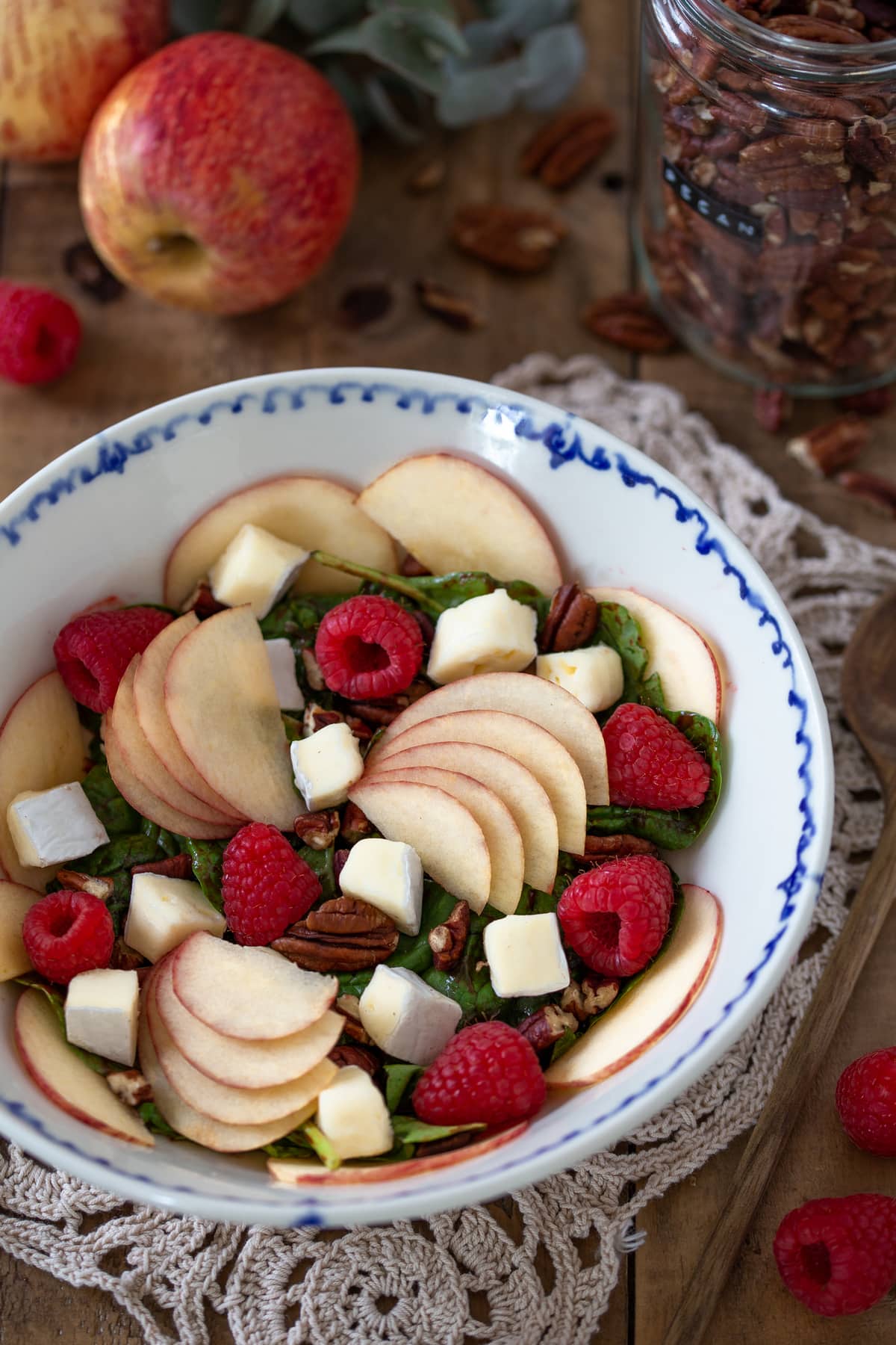 Apple brie salad with raspberries and pecans.