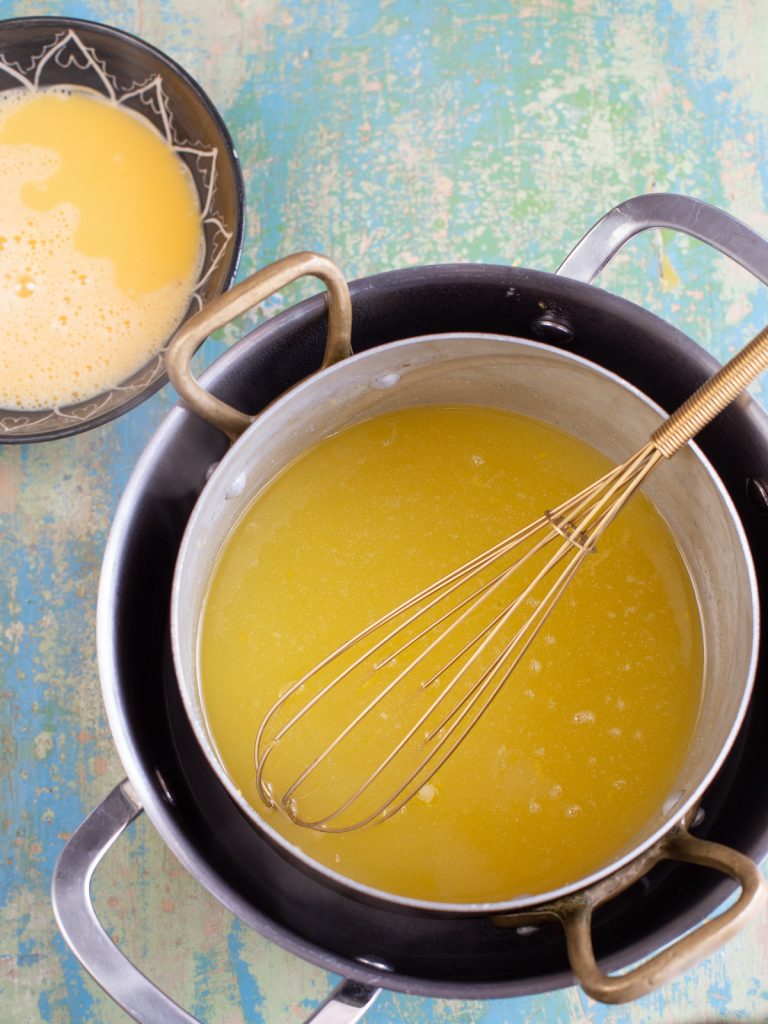 Making ginger lemon curd on a double boiler.