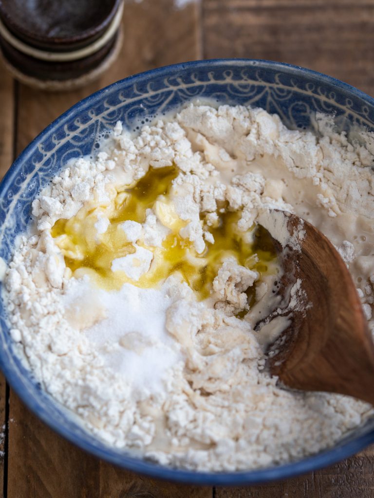 Adding the olive oil and salt.