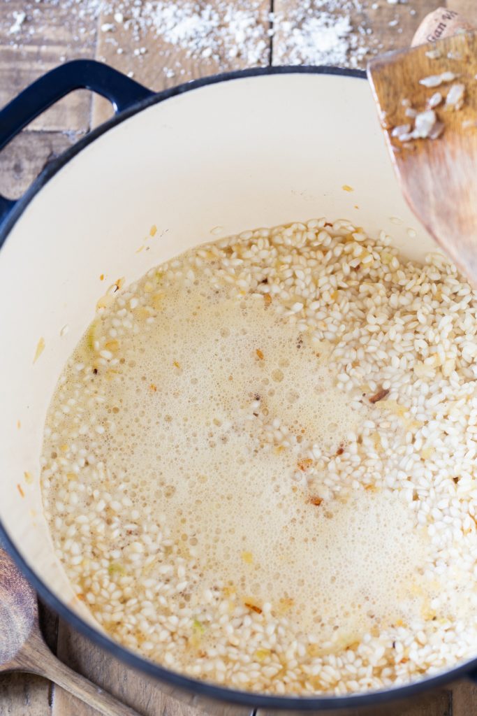 Add prosecco to rice.