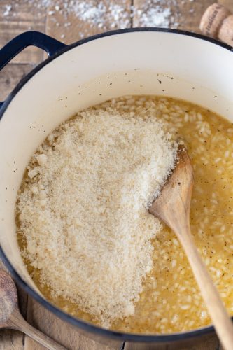 Adding parmesan to risotto.