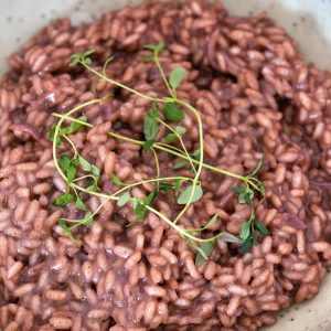 Closeup view of red wine risotto.