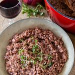 Simple red wine risotto topped with fresh thyme.
