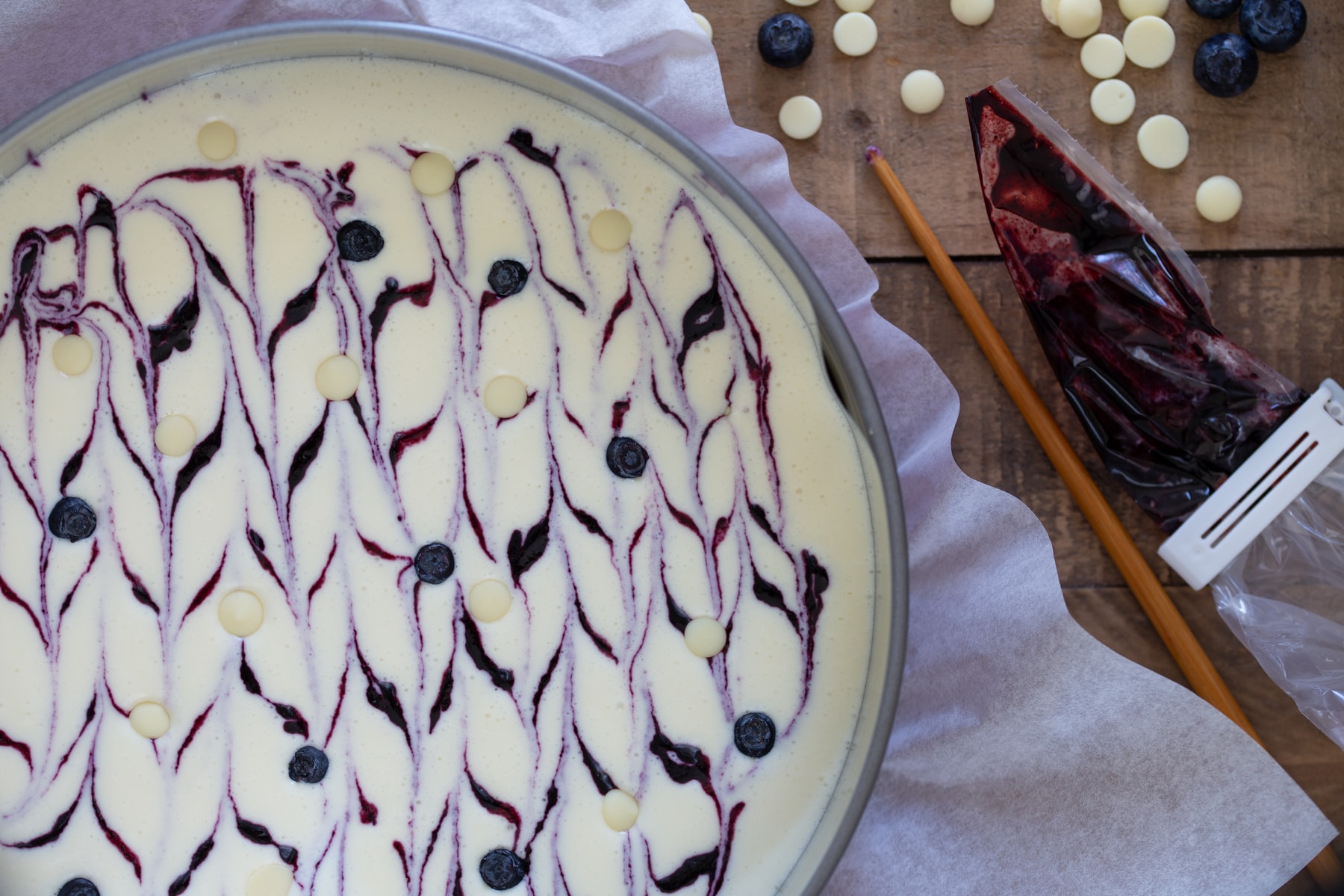 Ading blueberries and chocolate chips as topping.