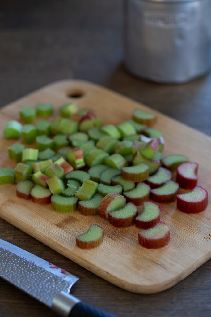 Chopped rhubarb stalks on a cutting board.