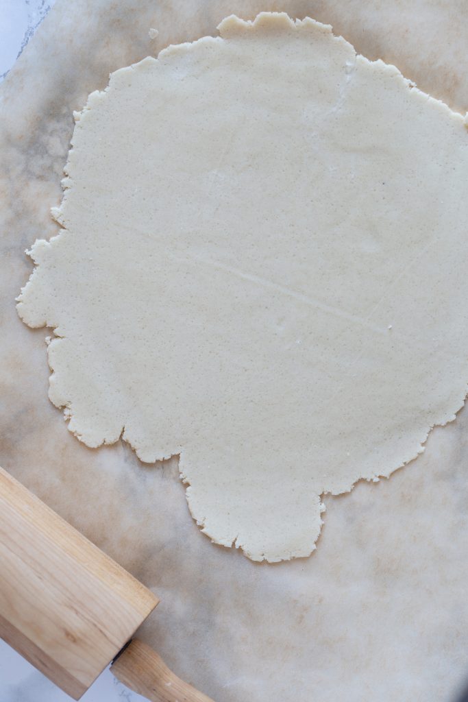 Rolling out a layer of pastry.