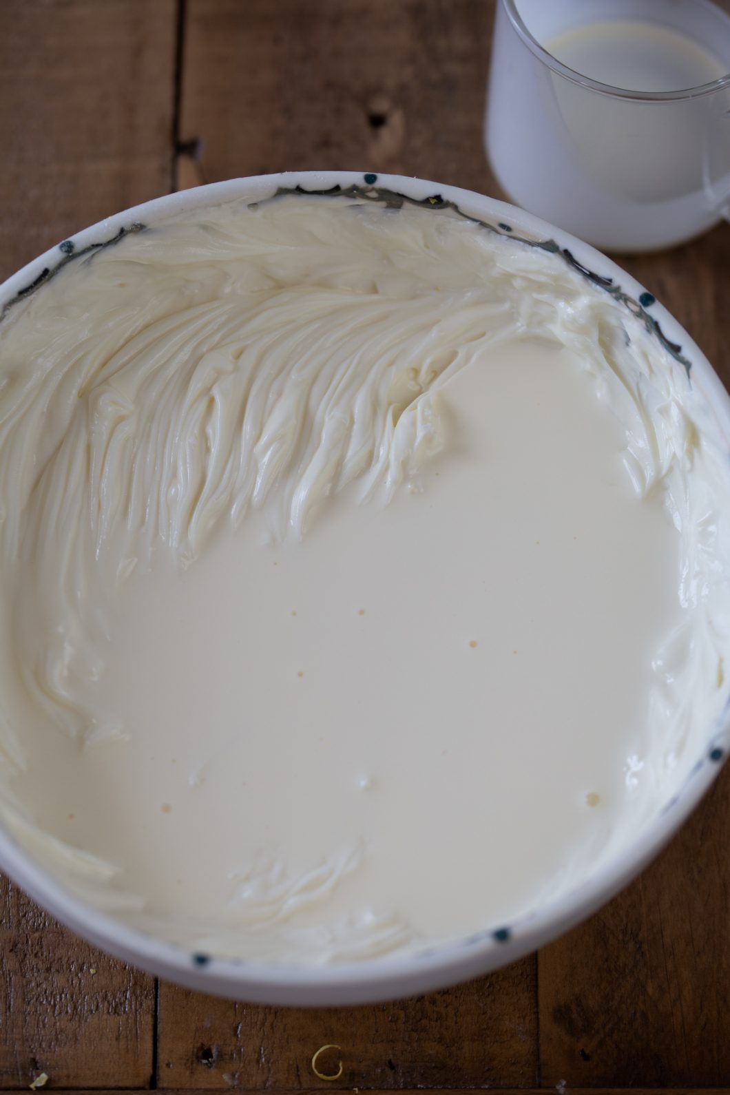 Adding cream to whipped cream cheese.