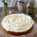 Carrot cake with cream cheese frosting on top.