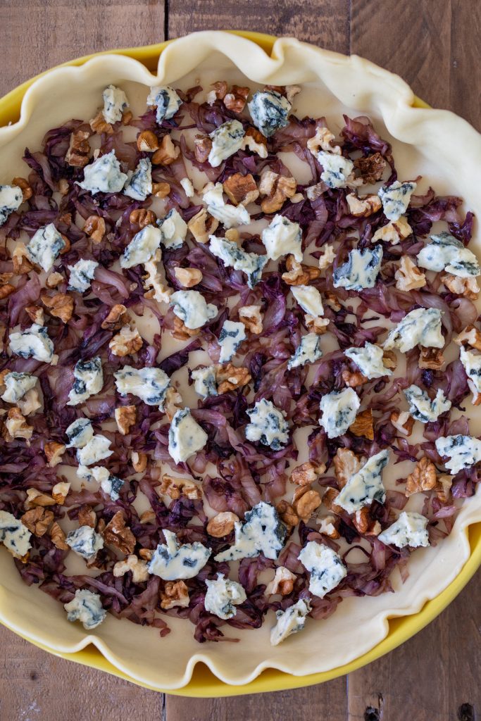 Add main ingredients to shortcrust pastry.