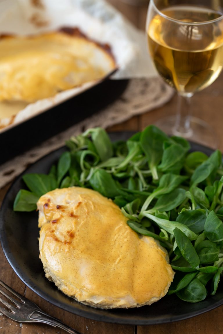 Baked mustard chicken served with salad.