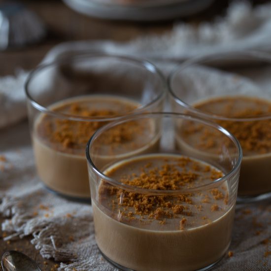 Biscoff panna cotta with crumbled Lotus Biscoff biscuits on top.