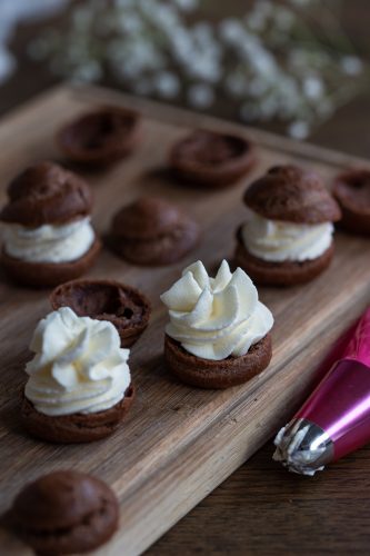 Fillin choux pastry with whipped cream.