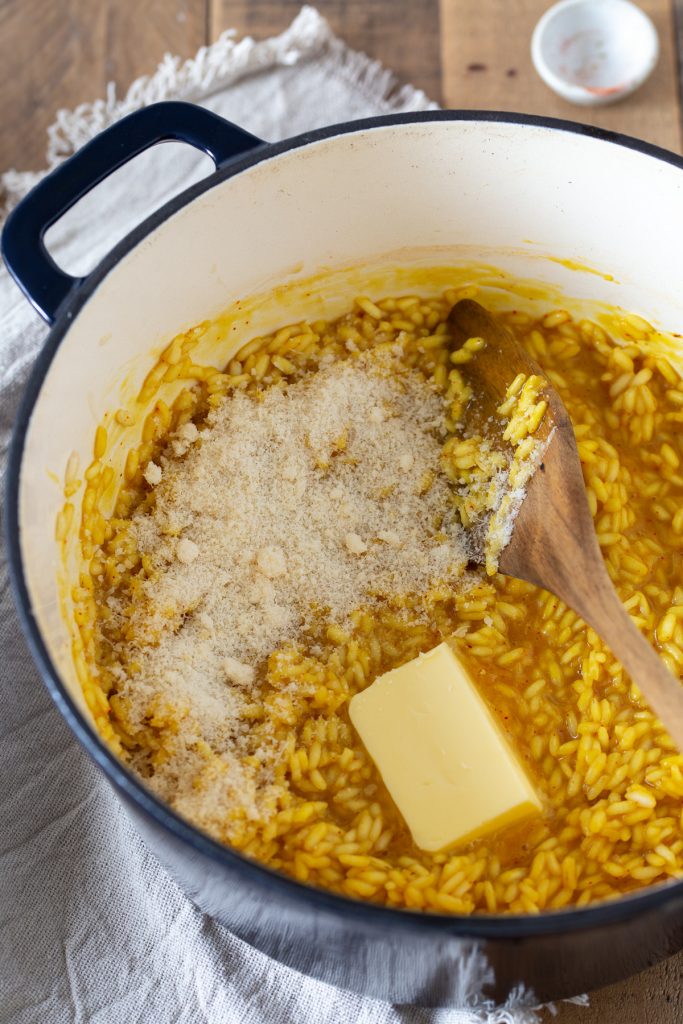 The last step in risotto preparation: folding in the parmesan and the butter.