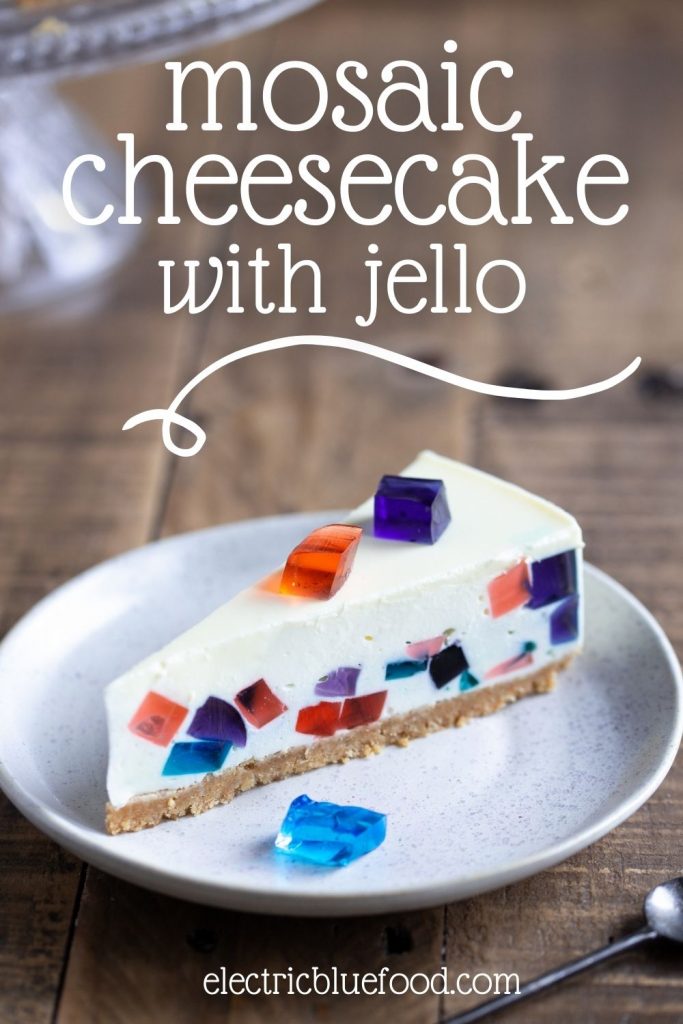Mosaic Cheesecake with jello is a beautiful no-bake cheesecake with a stained glass pattern. Colorful jello folded into cheesecake filling creates a broken glass effect that makes every slice a surprise. Top with jello dice for a gemstone effect.