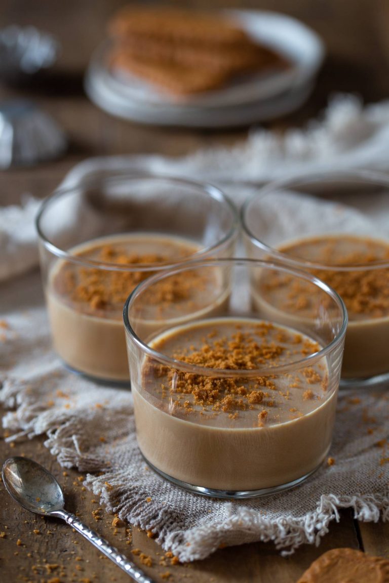 The biscoff panna cotta inside glasses, is topped with lotus cookie crumbles.