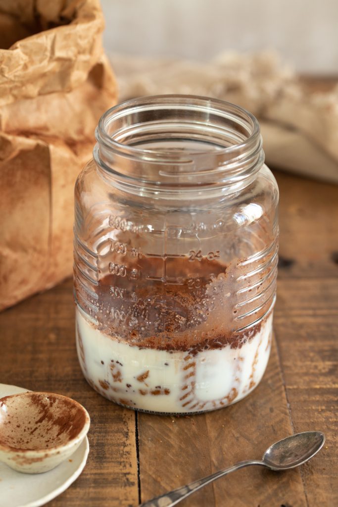 Cookies and cocoa added to warm milk.