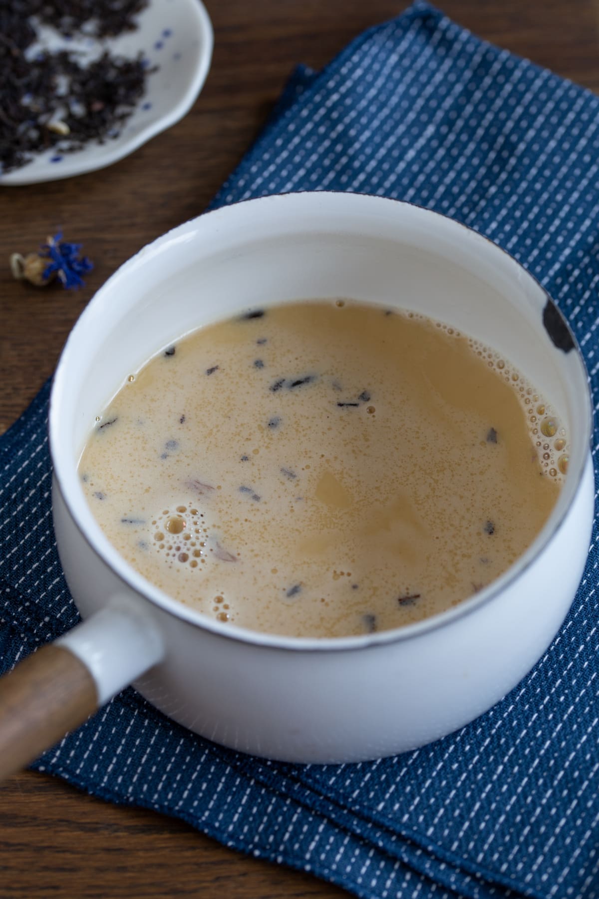 Infusing the cream with loose leaf tea.