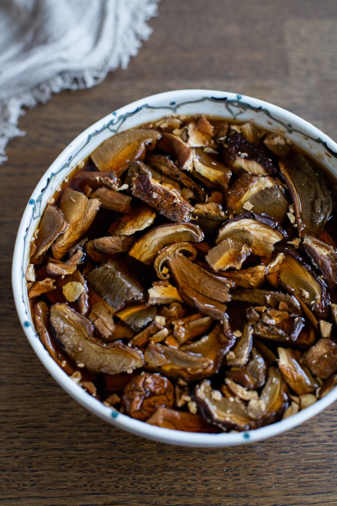 Dried porcini soaking in hot water.