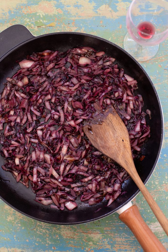 Sautéed radicchio in a skillet.