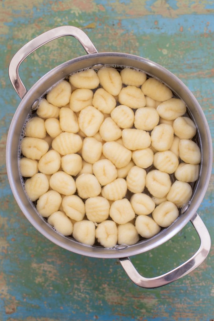 Gnocchi cooking in salted water.