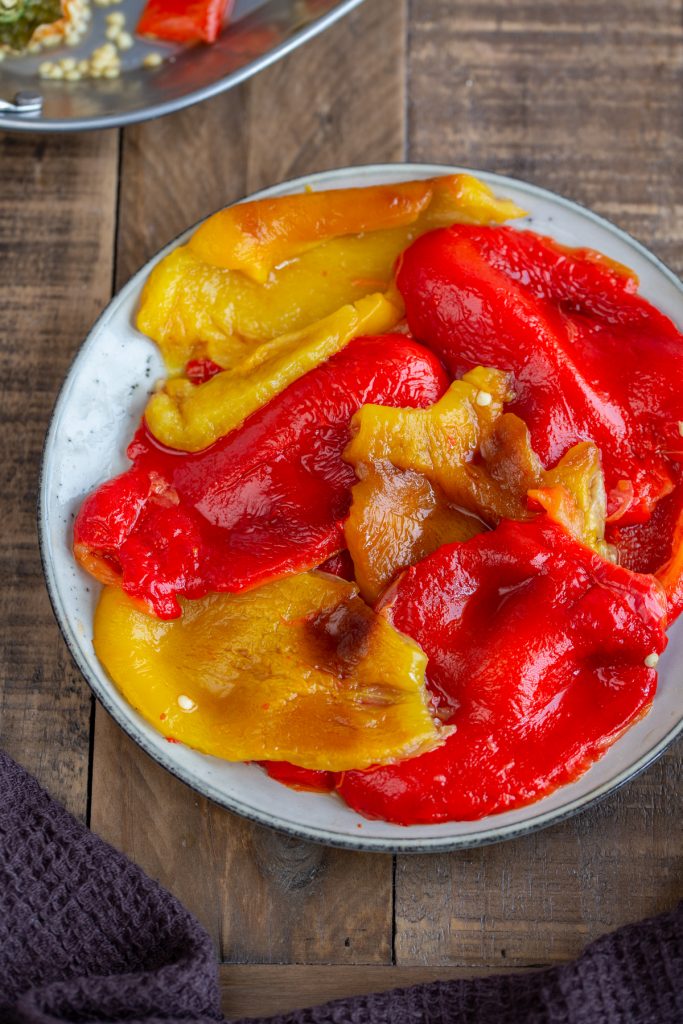 Slices of roasted peppers on a plate.
