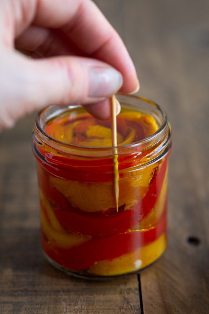 Getting rid of air bubbles with a toothpick.