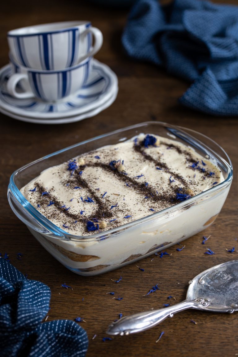 Earl Grey tiramisu topped with powdered tea and cornflower petals.