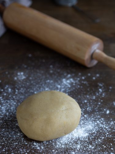 Ball of dough on a floured surface.