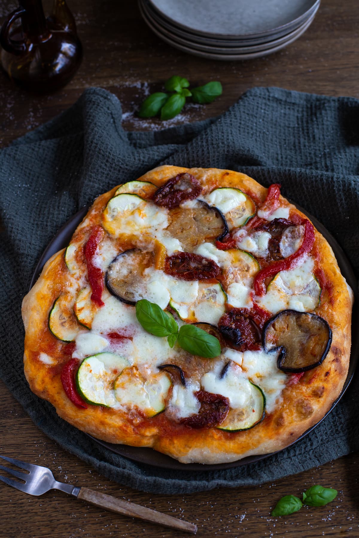 Vegetarian pizza with eggplant, zucchini and sundried tomatoes.