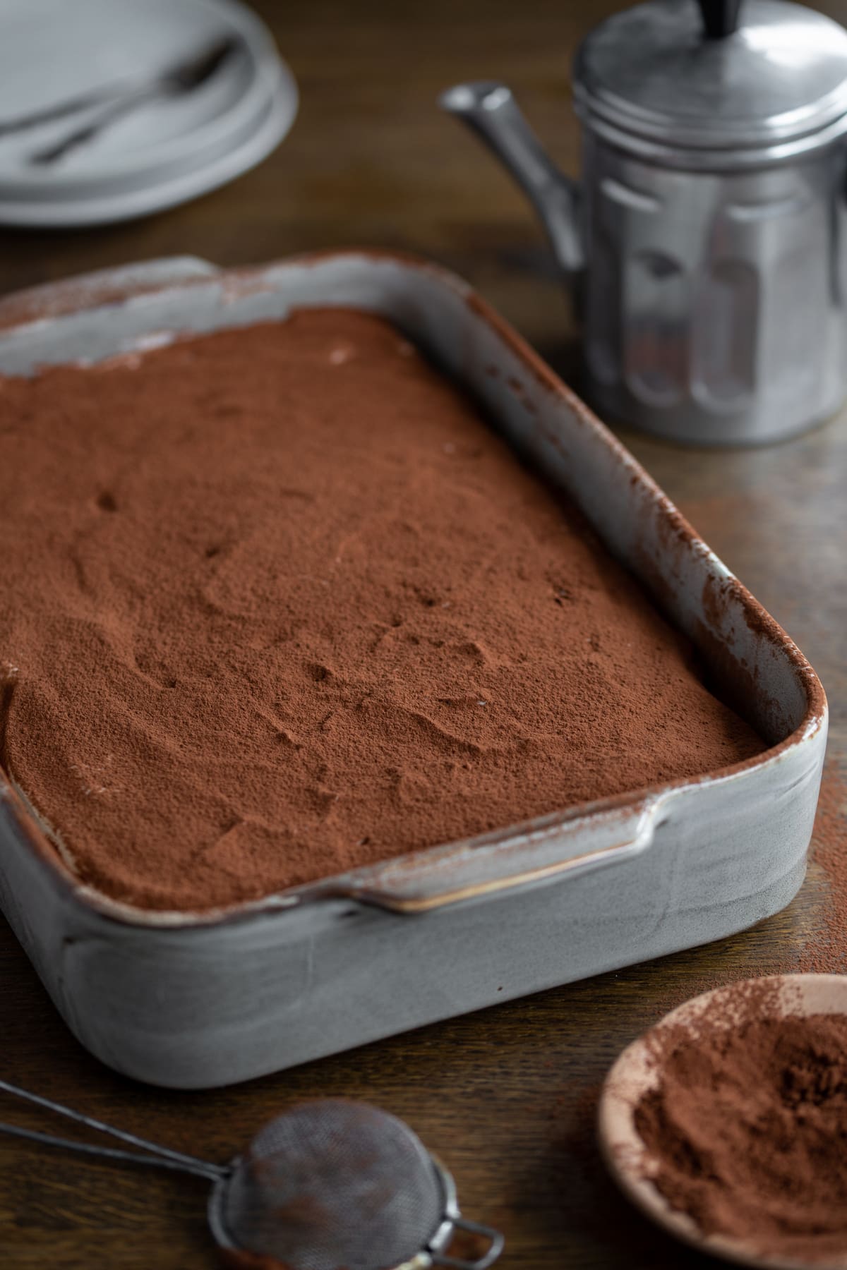 Final layer of cocoa powder on top.