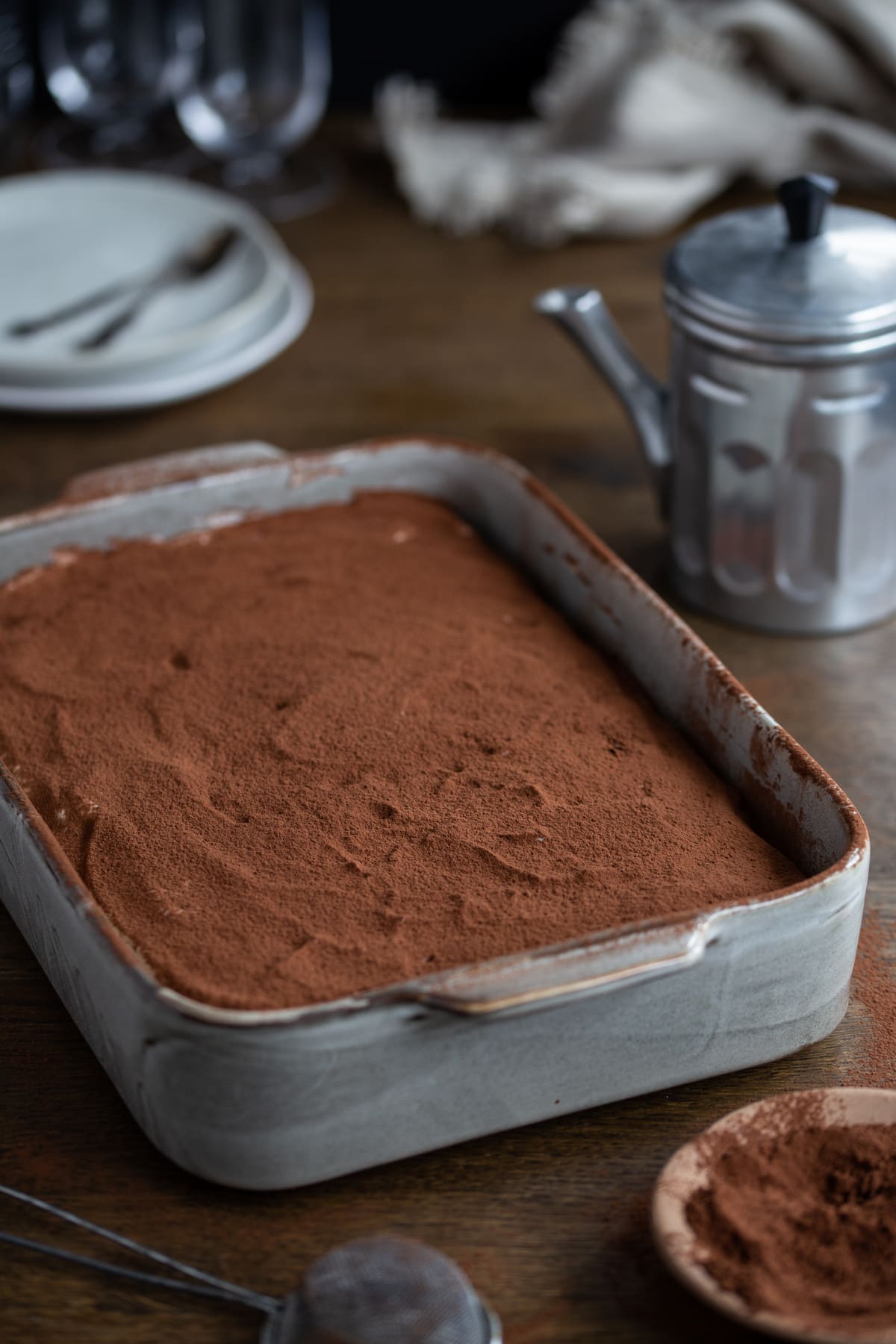 Classic tiramisu dusted with cocoa powder.