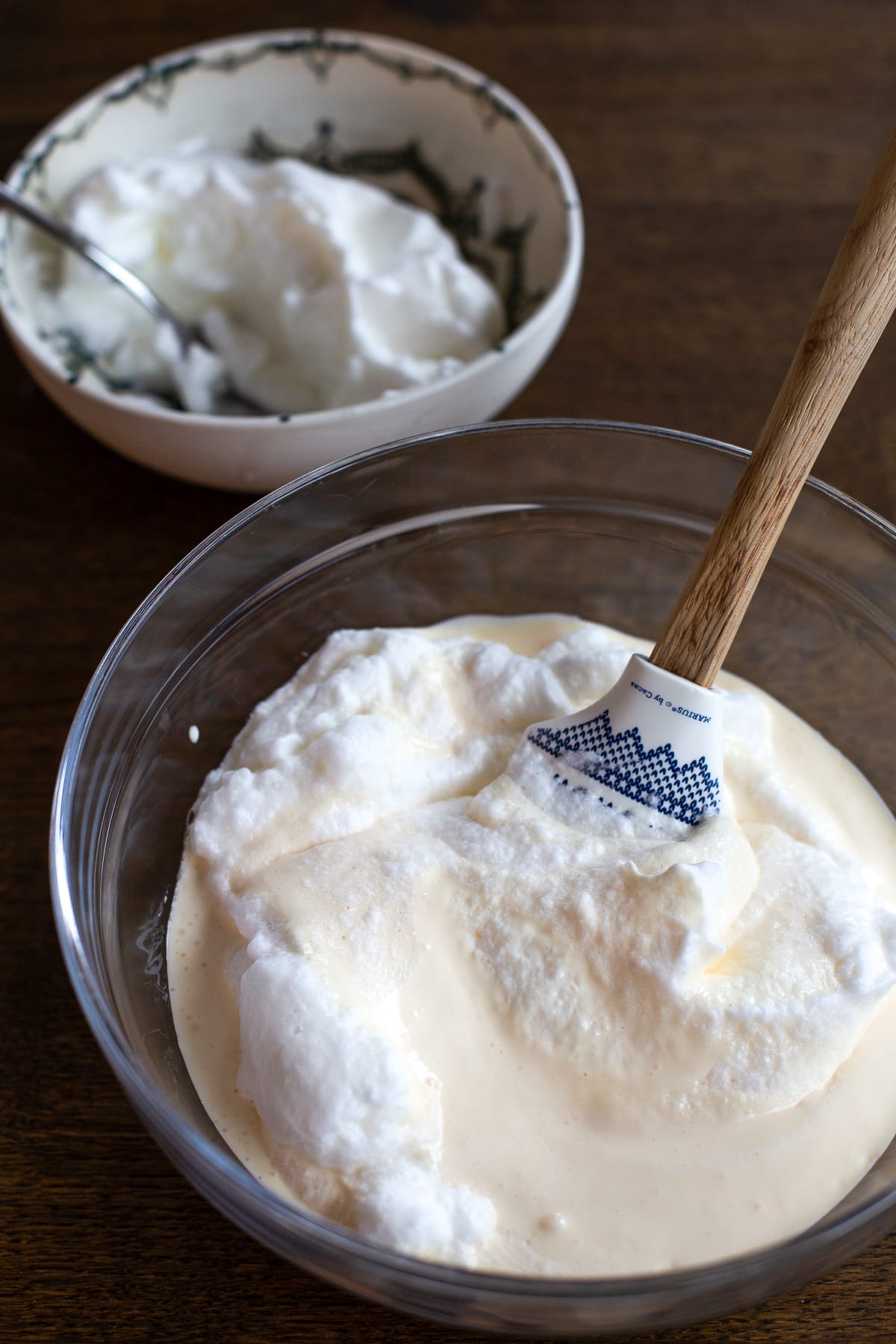 Folding egg whites into mascarpone cream.