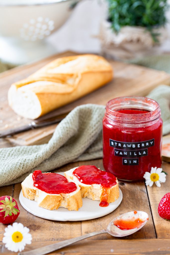 Strawberry and gin jam in a jar and on bread.