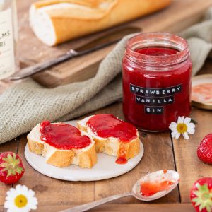 Strawberry and gin jam in a jar and on bread.