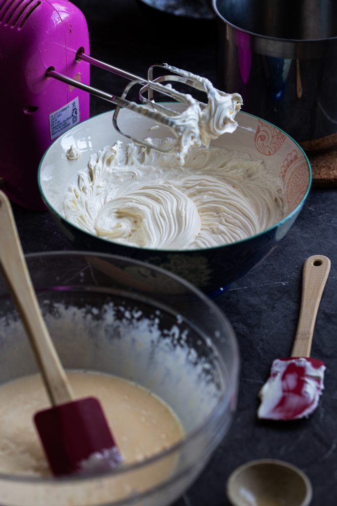 One bowl with pate a bombe, another bowl with whipped mascarpone.