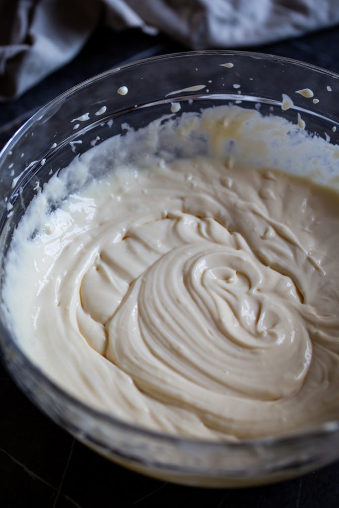 Mascarpone cream with pasteurized eggs in a clear bowl.