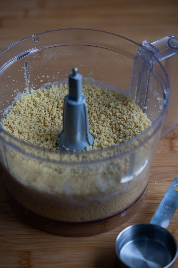 Pasta dough making in the process: showing the texture that resembles cous cous.