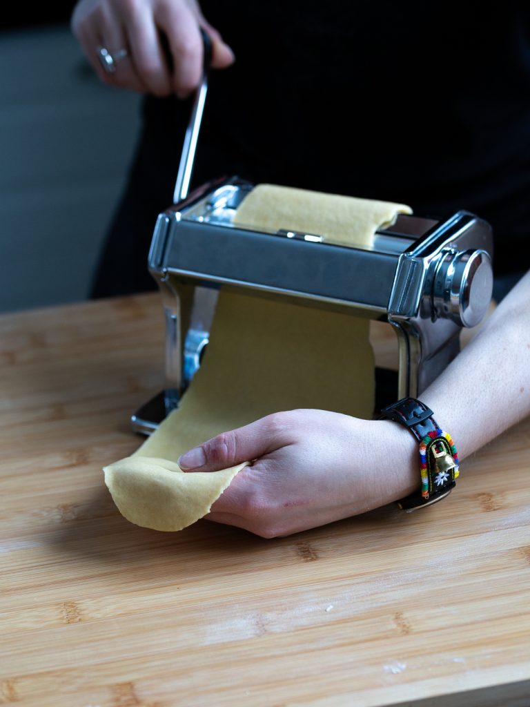 Making lasagne in a pasta machine.