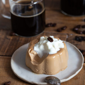 Panna cotta with a spoonful missing to show texture.