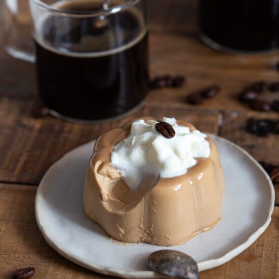 Panna cotta with a spoonful missing to show texture.