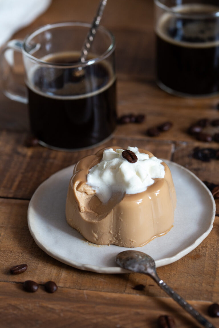 Panna cotta with a spoonful missing to show texture.