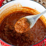 Detail of ragu on wooden spoon.