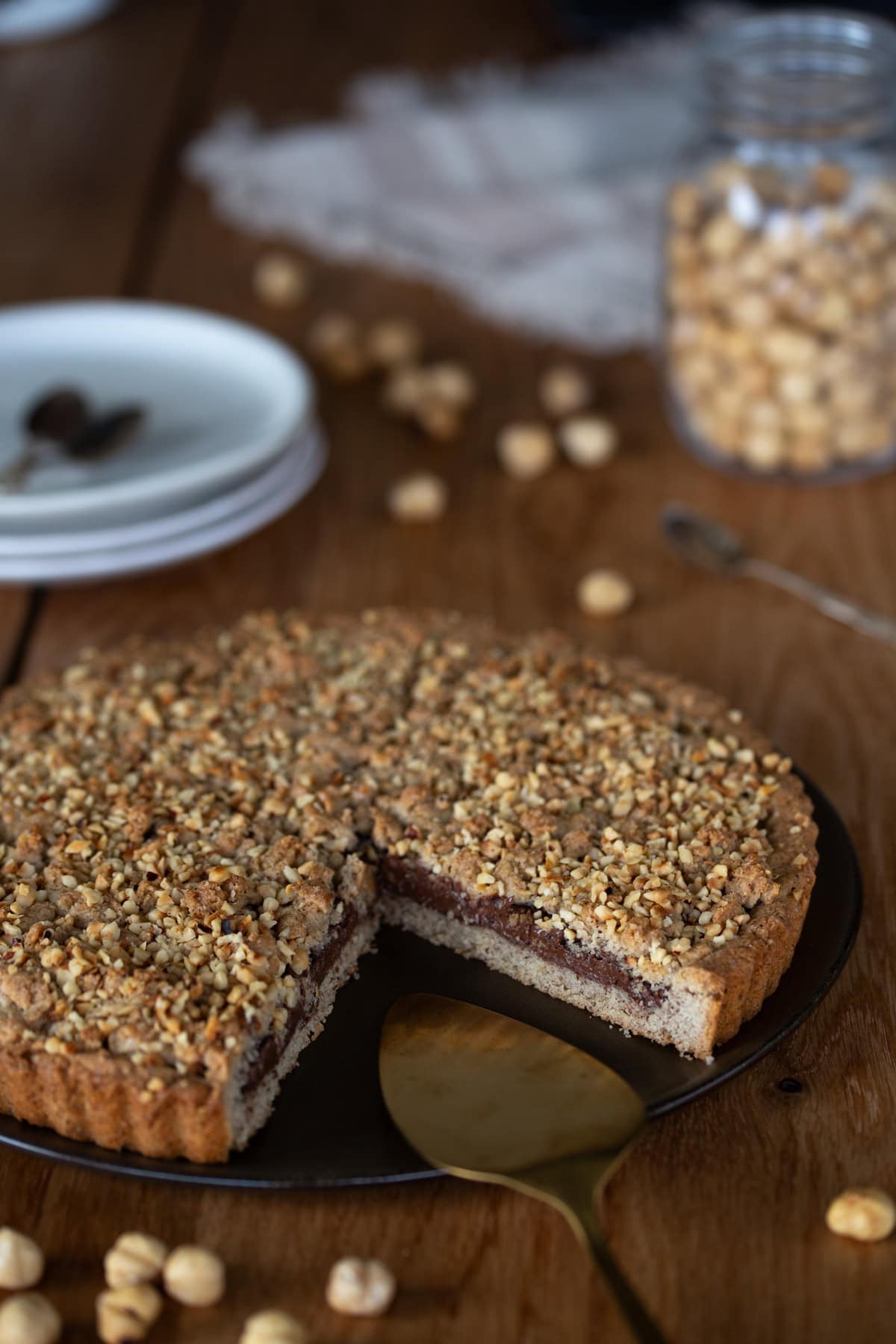 Hazelnut tart filled with nutella, sliced.