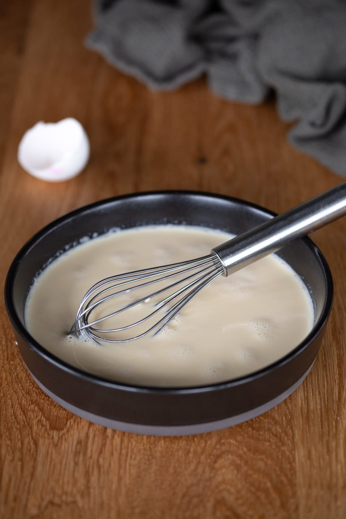 Egg and cream custard in a bowl.