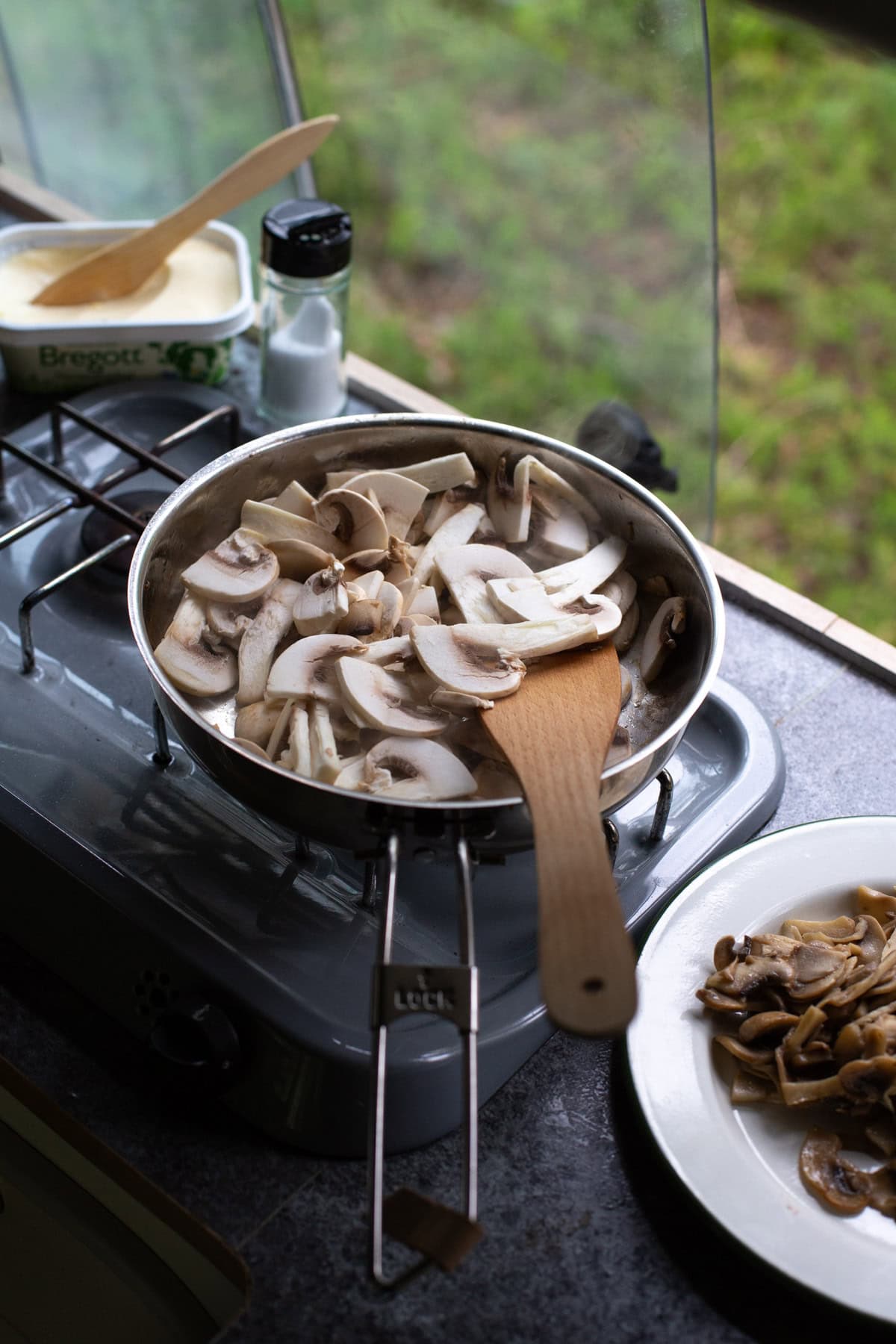 Cooking mushrooms on a camping stove.
